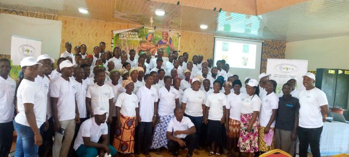 Farmers and agriculture extension agents in group photo during the sensitisation workshop in Asesewa on Cassava viral diseases.