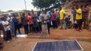 Participants at a demonstration with solar energy panels