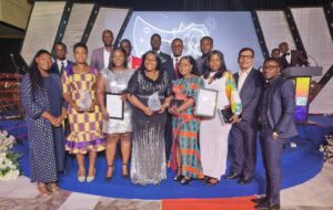 Staff of OlamAgri show off the AGI Award at the weekend.