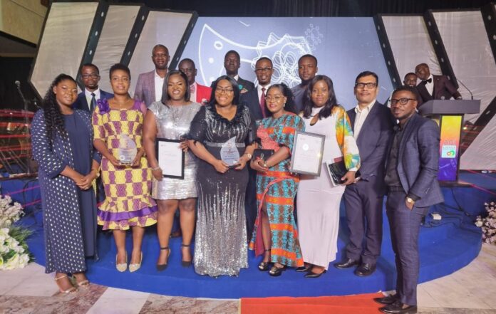 Staff of OlamAgri show off the AGI Award at the weekend.