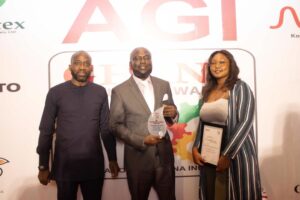 Mr. Charles Okyere Addo, Commercial Manager of Ghana Oil Palm Development Limited, in the middle, with the citation for GOPDC as the best company in the Eastern Region at the AGI Best Regional Company Award event in Accra.