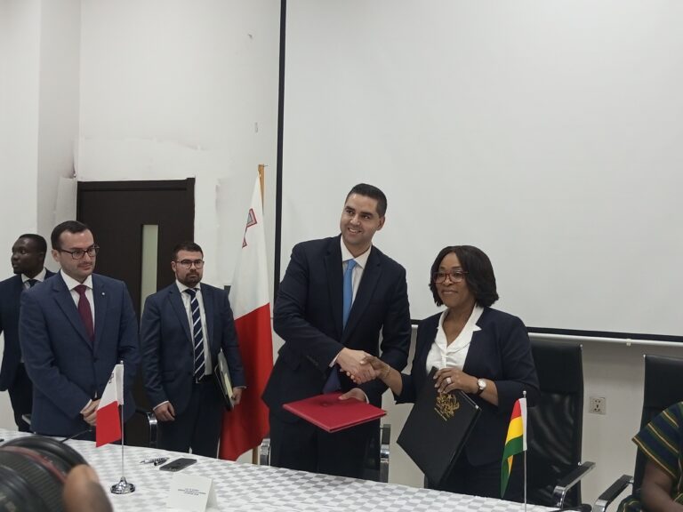 1. Madam Shirley Ayorkor Botchwey (first right) exchanging files with Dr Ian Borg