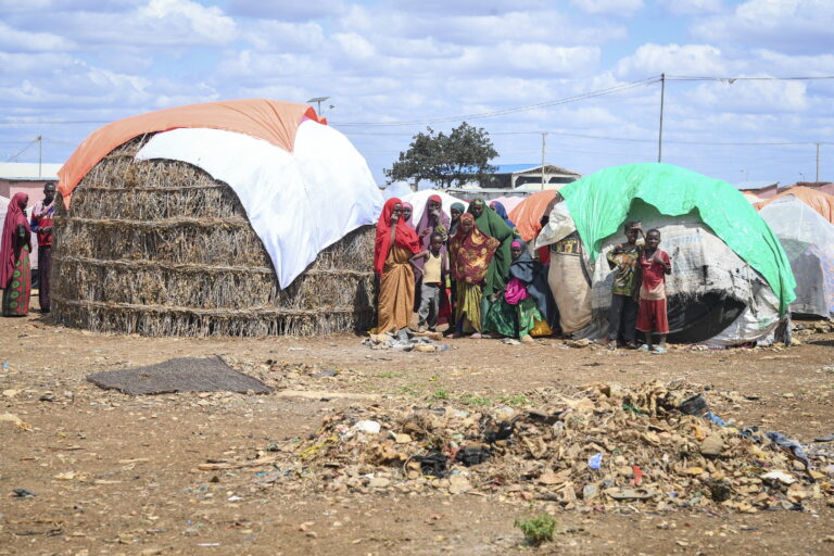 Women and children stand outside their makeshift shelters within Raama Cadeey Internally Displaced Persons (IDPs) camp in Baidoa, Somalia. ©UN Photo / Fardosa Hussein