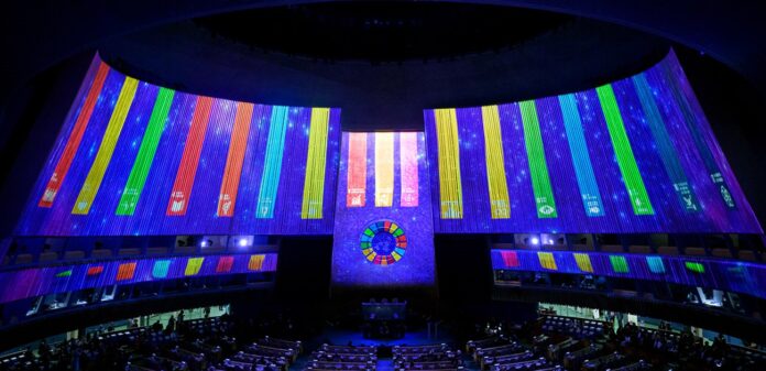 The UN General Assembly hall displays the 17 Sustainable Development Goals. ©UN Photo/Manuel Elias