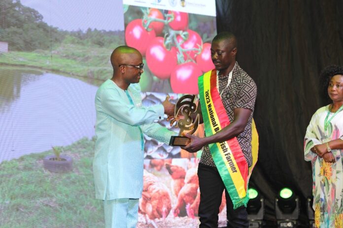 Mr Dadson accepts his award