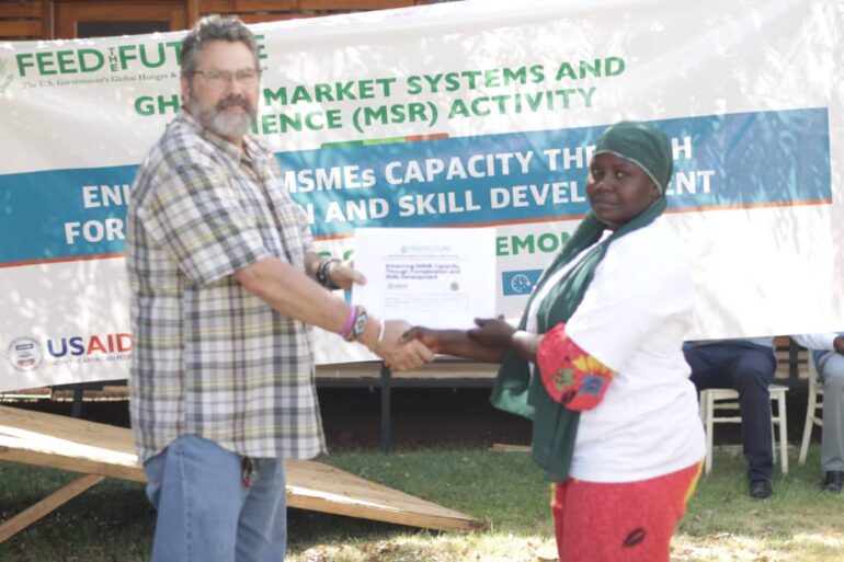 Participants receiving their certificates from officials