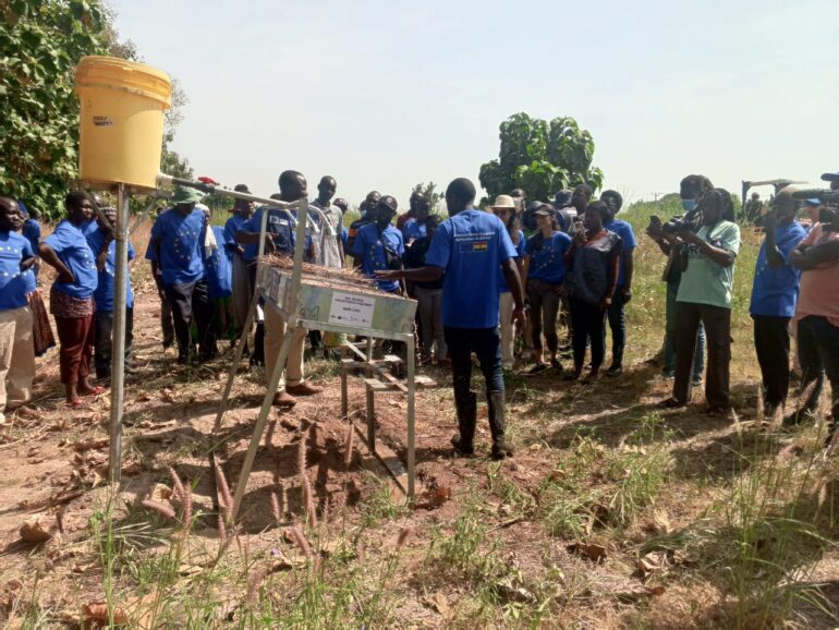 The team observing the soil erosion demonstration at BARS 