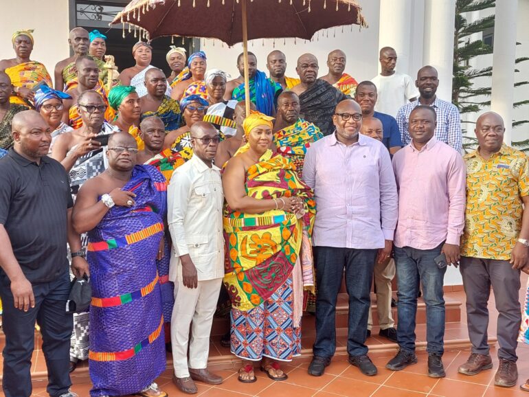 Dr Abbey posed with Odeneho Dwaben and some staff    