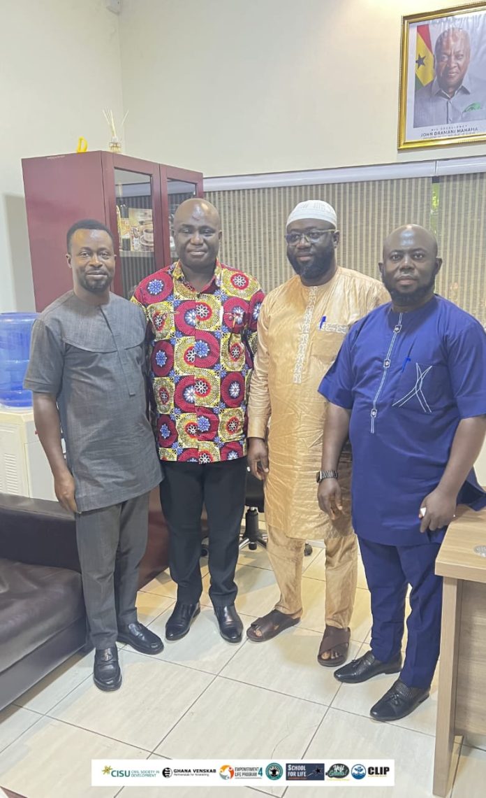 Mr Opoku (in African print) with officials from CLIP 