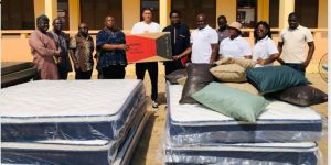 Photo caption: Photo showing Mr Ernest Adombire-naba presenting the items to Mr Jacob Abugri Aka-Eri, as others look on 