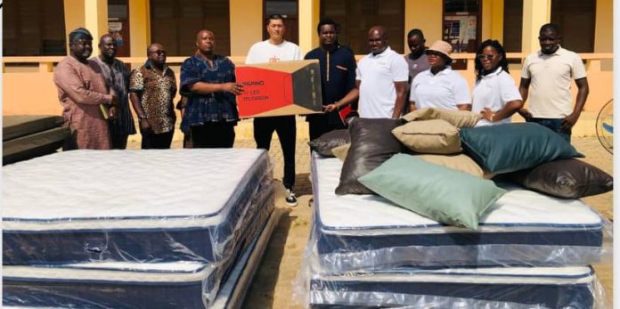 Photo caption: Photo showing Mr Ernest Adombire-naba presenting the items to Mr Jacob Abugri Aka-Eri, as others look on 