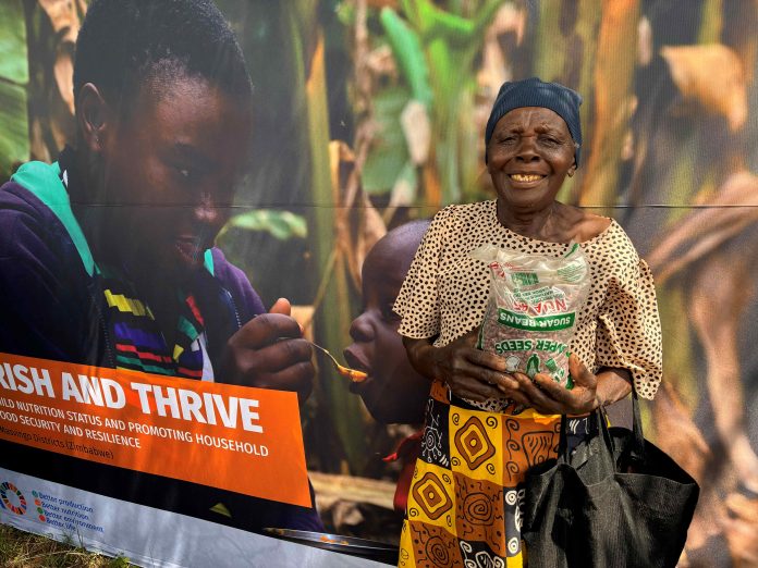 A smile of resilience, empowering households to nourish and thrive through improved nutrition and food security ©FAO/Leticia Njowola