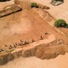 Aerial view of community members taking part in FAO's cash-for-work initiative to rehabilitate a communal water catchment, strengthening local water access and resilience in Galka’ayo, Galmudug State, Somalia. ©FAO / Arete/Ali Adan