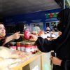 A woman entrepreneur supported by FAO sells her products at the 34th National Agricultural Products Exhibition and Farmers Festival (AgFair) in Kabul. ©FAO/Fahim Rahimi