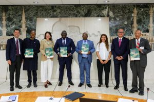 From left, Kaveh Zahedi, FAO Assistant Director-General and Director of the Office of Climate Change, Biodiversity and Environment (OCB), Seyni Nafo, Secretary General of the AAA Initiative, Çomoğlu Ülgen, Ambassador of the Republic of Türkiye to Italy, Bernard Kini Comoé, Minister Delegate for Food Crop Production of Côte d'Ivoire, Godfrey Magwenzi, FAO Deputy Director-General, Ghita el Ghorfi, Director General of the AAA Initiative, Youssef Balla, Ambassador of the Kingdom of Morocco to Italy and Permanent Representative to the United Nations Organisations in Rome, and Rattan Lal, Distinguished Professor of Soil Science, The Ohio State University, 2020 World Food Prize laureate, and AAA Scientific Committee member stand for a group photo holding the book “The State of African Agricultural adaption, 2016-2026 Assessment and Roadmap to 2036” during the High-Level Event Celebrating 10 Years of the AAA Initiative; FAO headquarters (King Faisal Room).©FAO/Pier Paolo Cito